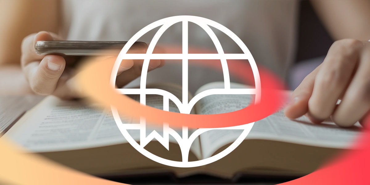 Global Bible Month. Person reading bible and phone.